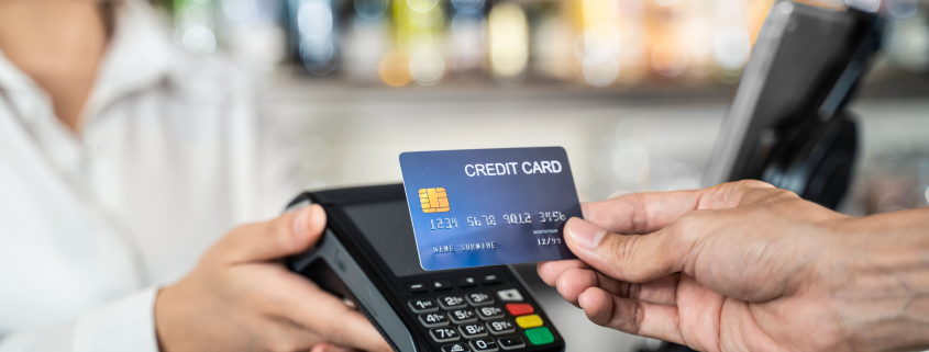 close up of customer hand using dummy credit card 2021 10 28 21 20 13 utc min